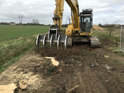 Root rake clearing tree stumps