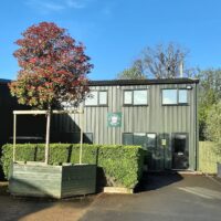 Picture shows Practicality Browns office in Iver with a large Photinia tree in the front.